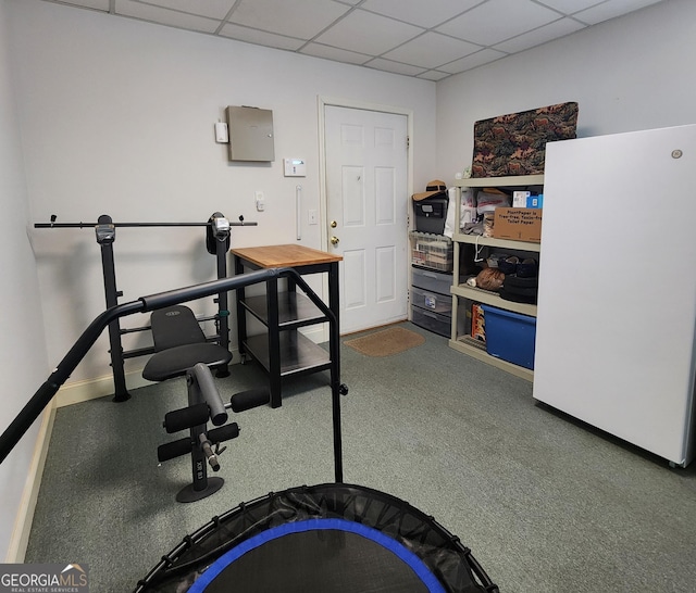 office area featuring baseboards and a drop ceiling