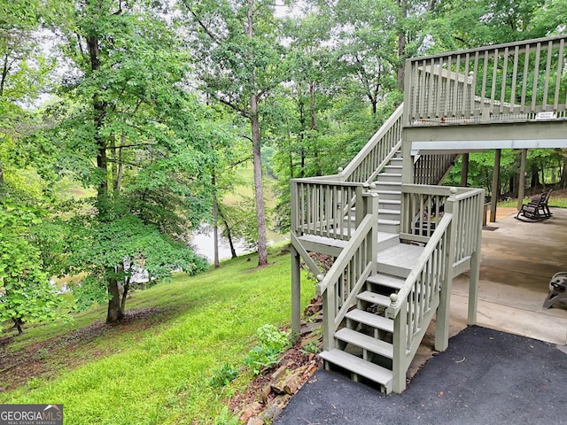 327 Kissimmee Trl, Cornelia, GA 30531 - view of grassy yard with stairway and a wooden deck