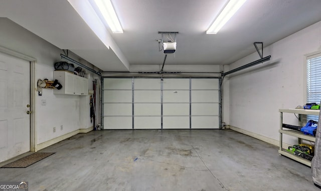 327 Kissimmee Trl, Cornelia, GA 30531 - garage with a garage door opener and baseboards