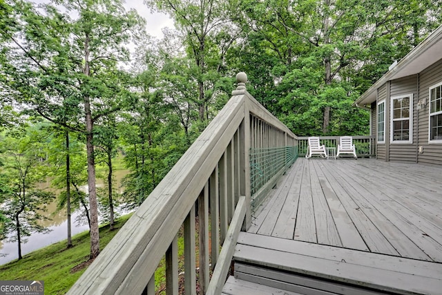 327 Kissimmee Trl, Cornelia, GA 30531 - wooden deck featuring view of wooded area and a water view