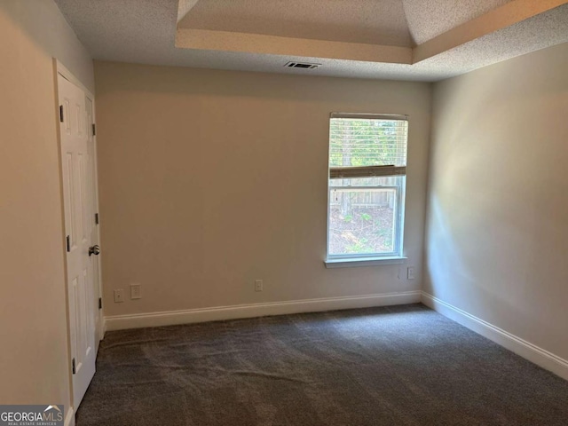 4234 Winston Cir, Atlanta, GA 30349 - spare room featuring baseboards, dark colored carpet, visible vents, and a textured ceiling