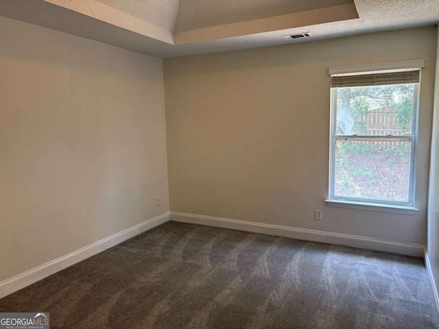 4234 Winston Cir, Atlanta, GA 30349 - empty room featuring dark colored carpet, visible vents, and baseboards