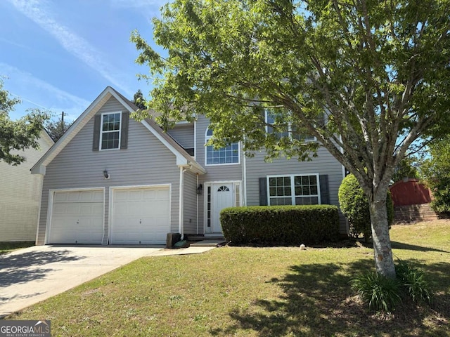 4234 Winston Cir, Atlanta, GA 30349 - view of front of home featuring a garage, a front lawn, and concrete driveway