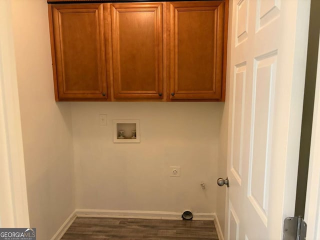 4234 Winston Cir, Atlanta, GA 30349 - laundry room featuring electric dryer hookup, dark wood finished floors, washer hookup, and cabinet space