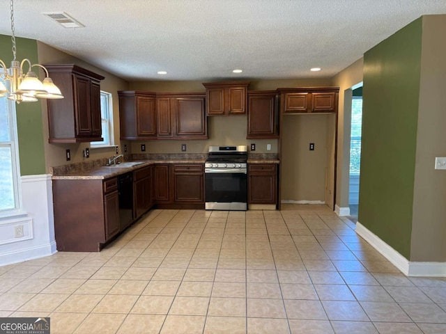 4234 Winston Cir, Atlanta, GA 30349 - kitchen featuring a textured ceiling, stainless steel gas range, visible vents, a notable chandelier, and dishwashing machine
