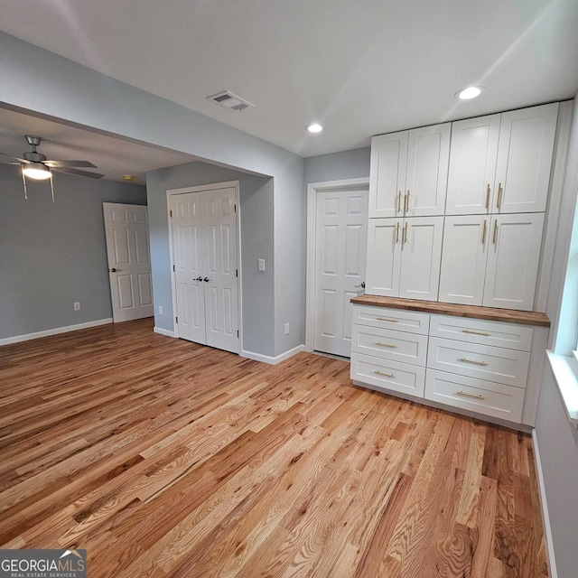 unfurnished bedroom featuring recessed lighting, baseboards, visible vents, and light wood-style flooring