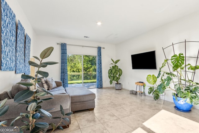 living room with visible vents and tile patterned flooring