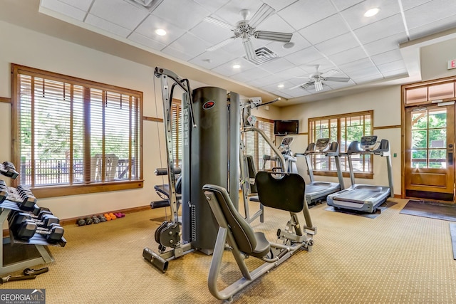 gym with a drop ceiling, baseboards, carpet, recessed lighting, and ceiling fan