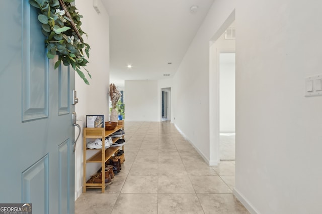 corridor with light tile patterned floors, visible vents, and recessed lighting