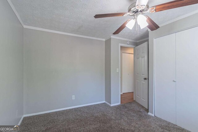 2092 Countydown Ln, Stone Mountain, GA 30088 - unfurnished bedroom with a textured ceiling, carpet flooring, and ornamental molding