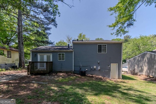 2092 Countydown Ln, Stone Mountain, GA 30088 - back of house featuring a lawn and a wooden deck