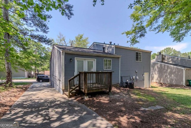 2092 Countydown Ln, Stone Mountain, GA 30088 - back of house with french doors and central AC