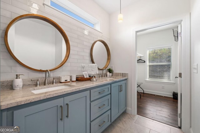 1016 Twisted Oak Rd Unit 115, Talking Rock, GA 30175 - bathroom with double vanity, tasteful backsplash, plenty of natural light, and tile patterned flooring