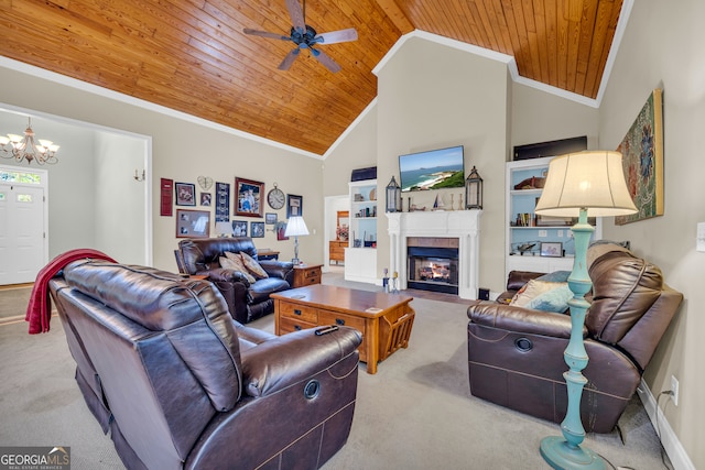 living area with crown molding, ceiling fan with notable chandelier, a fireplace, carpet floors, and wood ceiling
