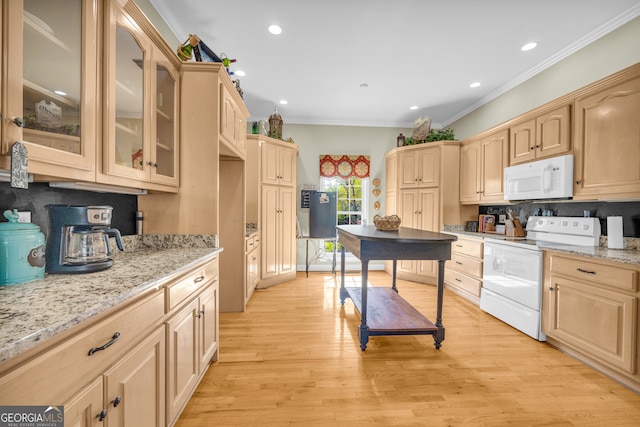 kitchen with light brown cabinets, backsplash, and white appliances