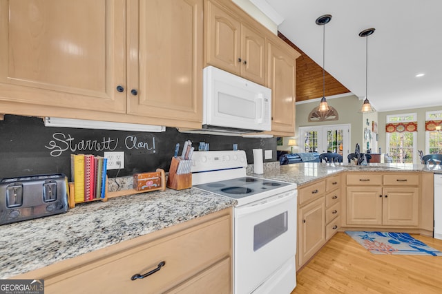 kitchen with tasteful backsplash, light brown cabinetry, light wood-style floors, white appliances, and light stone countertops