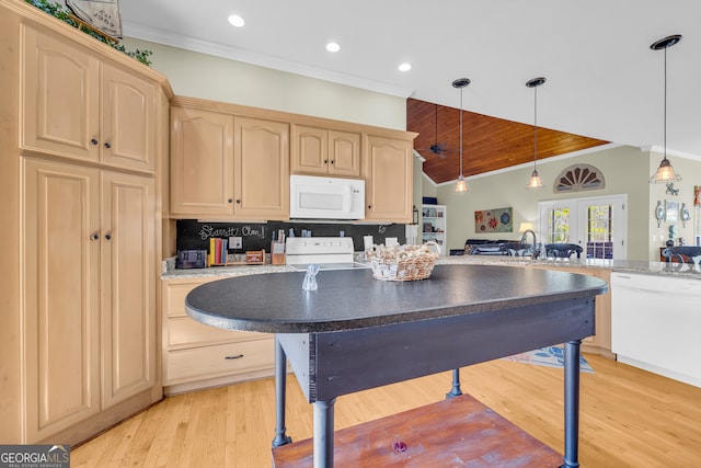 kitchen with light brown cabinets, white appliances, vaulted ceiling, and crown molding