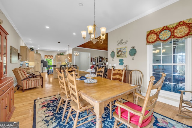 dining space featuring crown molding, light wood-type flooring, a notable chandelier, and recessed lighting