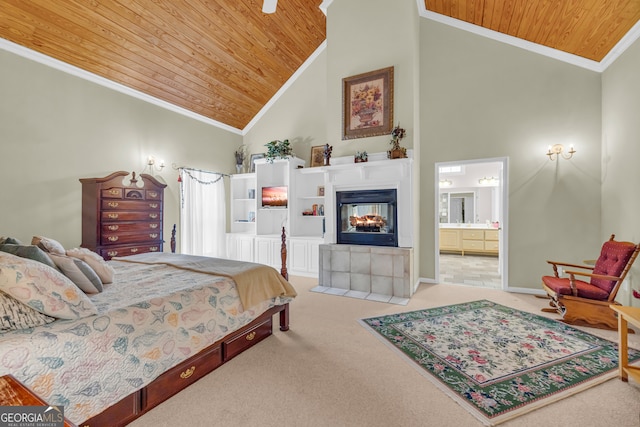 carpeted bedroom with vaulted ceiling, a tile fireplace, crown molding, and wood ceiling