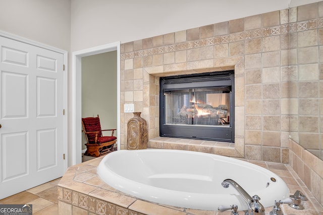 full bathroom featuring a bath and a multi sided fireplace