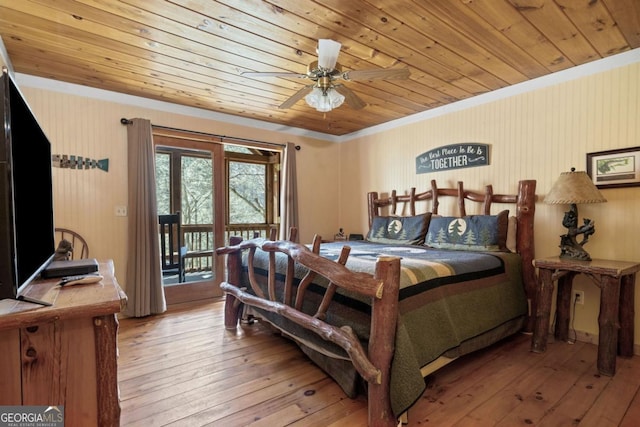 bedroom featuring wood ceiling, crown molding, access to exterior, and light wood finished floors