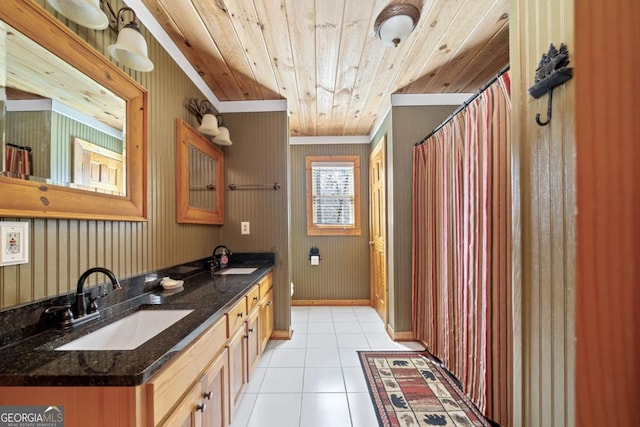 bathroom featuring wood ceiling, tile patterned floors, a sink, and double vanity