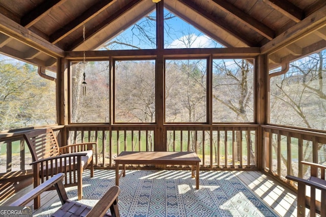 sunroom featuring a wealth of natural light and beam ceiling