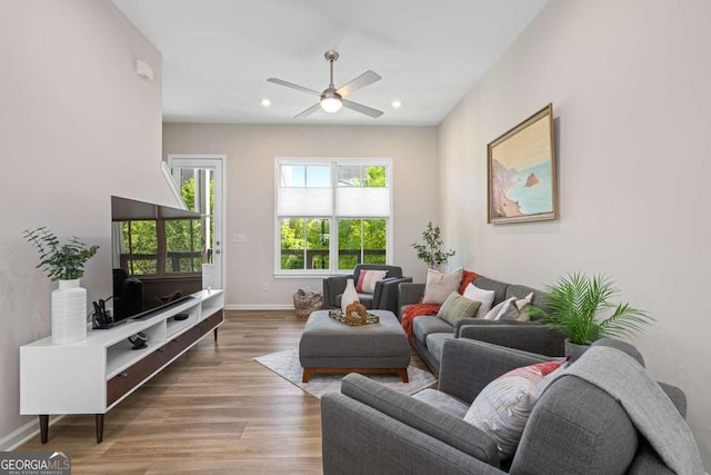 living room featuring recessed lighting, wood finished floors, a ceiling fan, and baseboards