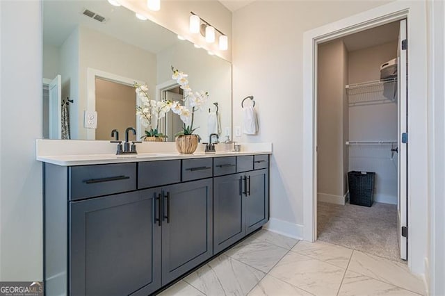 820 Fair View Cir, Roswell, GA 30076 - full bathroom with a walk in closet, marble finish floor, a sink, and double vanity