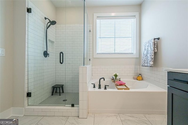 820 Fair View Cir, Roswell, GA 30076 - bathroom featuring vanity, a garden tub, marble finish floor, and a shower stall