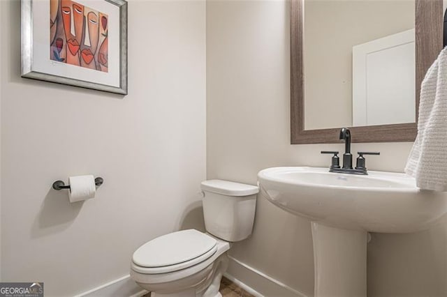 820 Fair View Cir, Roswell, GA 30076 - bathroom with baseboards, toilet, and a sink