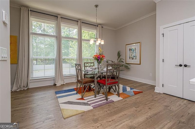 820 Fair View Cir, Roswell, GA 30076 - dining room featuring wood finished floors, baseboards, ornamental molding, and plenty of natural light