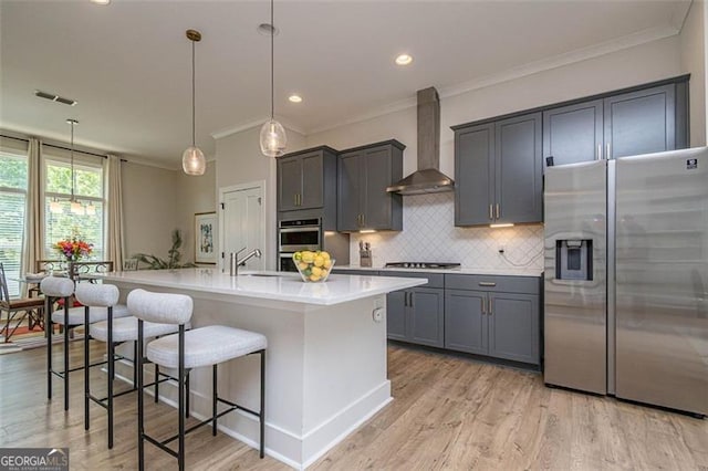 820 Fair View Cir, Roswell, GA 30076 - kitchen featuring ornamental molding, wall chimney range hood, appliances with stainless steel finishes, and light countertops