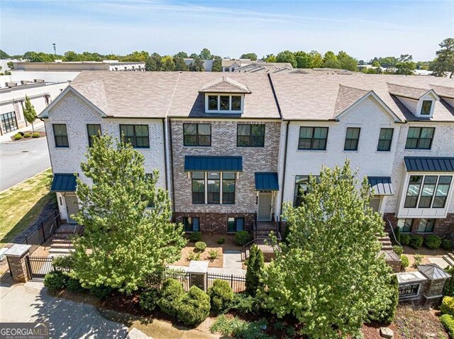 820 Fair View Cir, Roswell, GA 30076 - view of front facade with brick siding and a fenced front yard