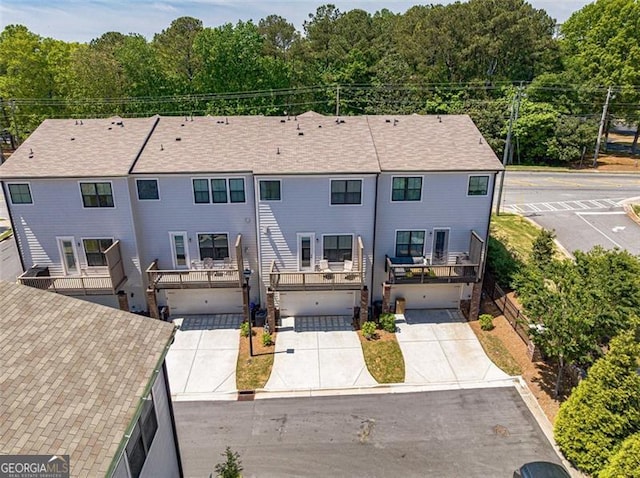 820 Fair View Cir, Roswell, GA 30076 - back of house with concrete driveway and an attached garage