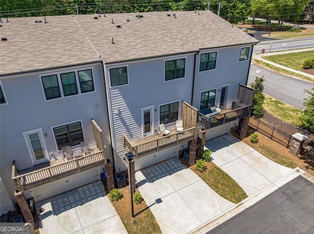 820 Fair View Cir, Roswell, GA 30076 - view of front of house featuring an attached garage, a shingled roof, fence, and concrete driveway