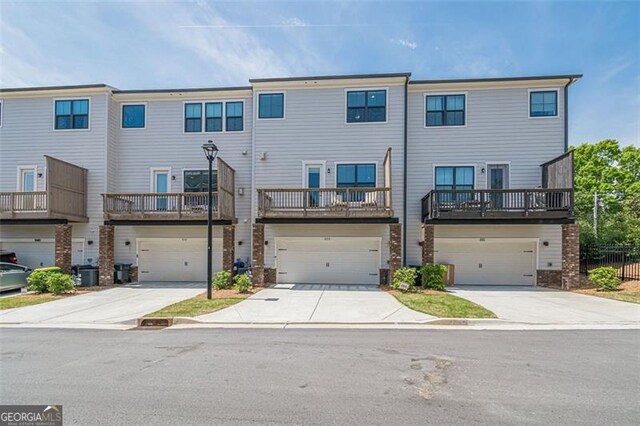 820 Fair View Cir, Roswell, GA 30076 - view of property featuring an attached garage, driveway, and central AC