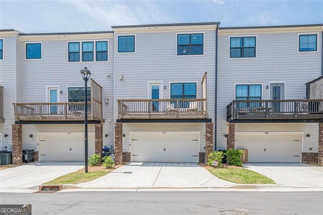 820 Fair View Cir, Roswell, GA 30076 - back of house with concrete driveway, an attached garage, and cooling unit