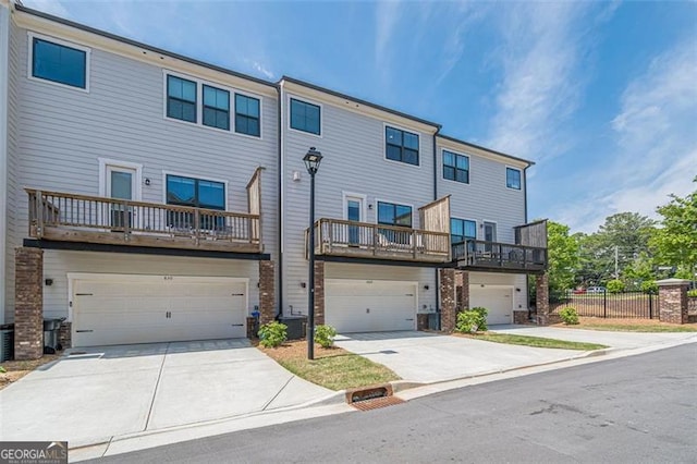 820 Fair View Cir, Roswell, GA 30076 - view of front facade featuring concrete driveway, central AC unit, and a garage