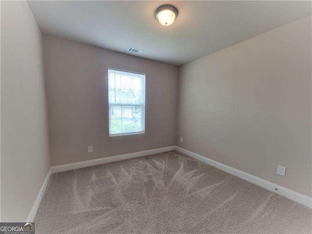 115 Heather Ln, Commerce, GA 30529 - carpeted empty room with visible vents and baseboards