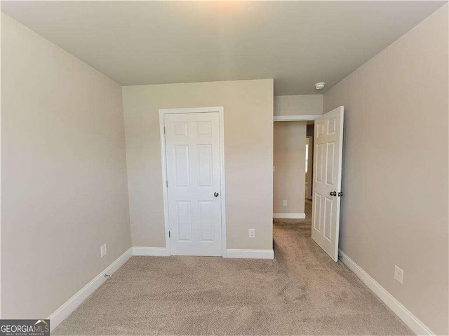 115 Heather Ln, Commerce, GA 30529 - unfurnished bedroom featuring light carpet and baseboards