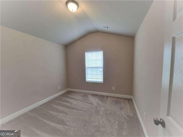 115 Heather Ln, Commerce, GA 30529 - additional living space featuring vaulted ceiling, visible vents, carpet flooring, and baseboards