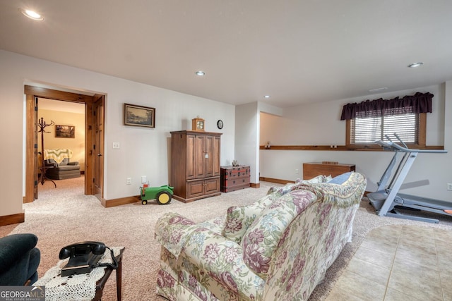 living area with recessed lighting, baseboards, and light colored carpet