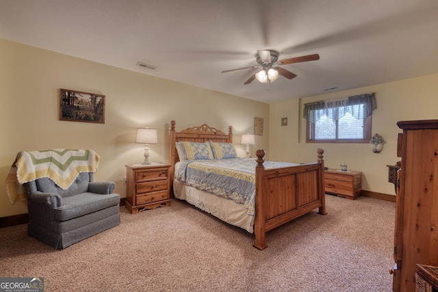 bedroom featuring carpet floors, visible vents, a ceiling fan, and baseboards