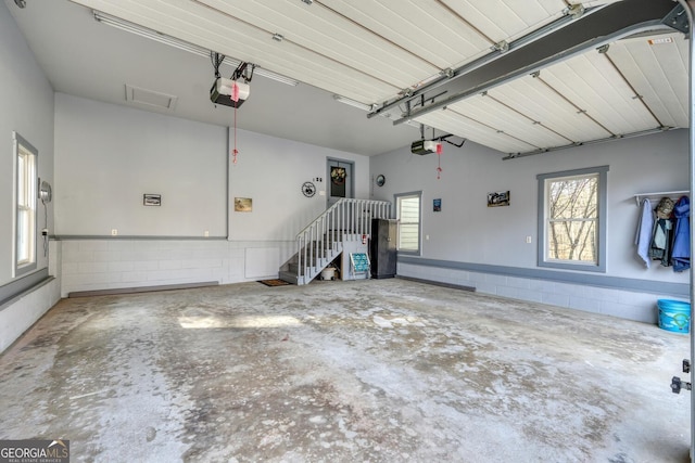 garage featuring a garage door opener