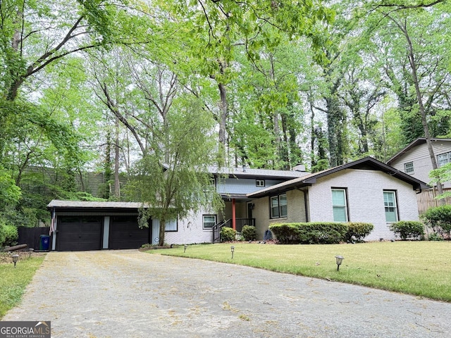 3629 Embry Cir, Atlanta, GA 30341 - view of front of home with an attached garage, brick siding, driveway, and a front yard
