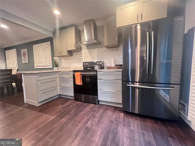 3629 Embry Cir, Atlanta, GA 30341 - kitchen featuring wall chimney range hood, electric range, a peninsula, dark wood-type flooring, and freestanding refrigerator