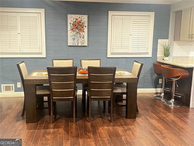 3629 Embry Cir, Atlanta, GA 30341 - dining space with visible vents, wallpapered walls, baseboards, and dark wood-style flooring
