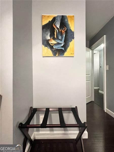 3629 Embry Cir, Atlanta, GA 30341 - hallway featuring baseboards and dark wood-style floors