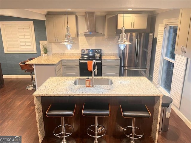 3629 Embry Cir, Atlanta, GA 30341 - kitchen with dark wood-type flooring, freestanding refrigerator, wall chimney exhaust hood, baseboards, and black electric range oven